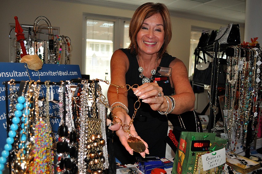 Susan Viteri shows off some of her jewelry during the combined chamber event Thursday, Sept. 22 at Bentley's Resort in Osprey.