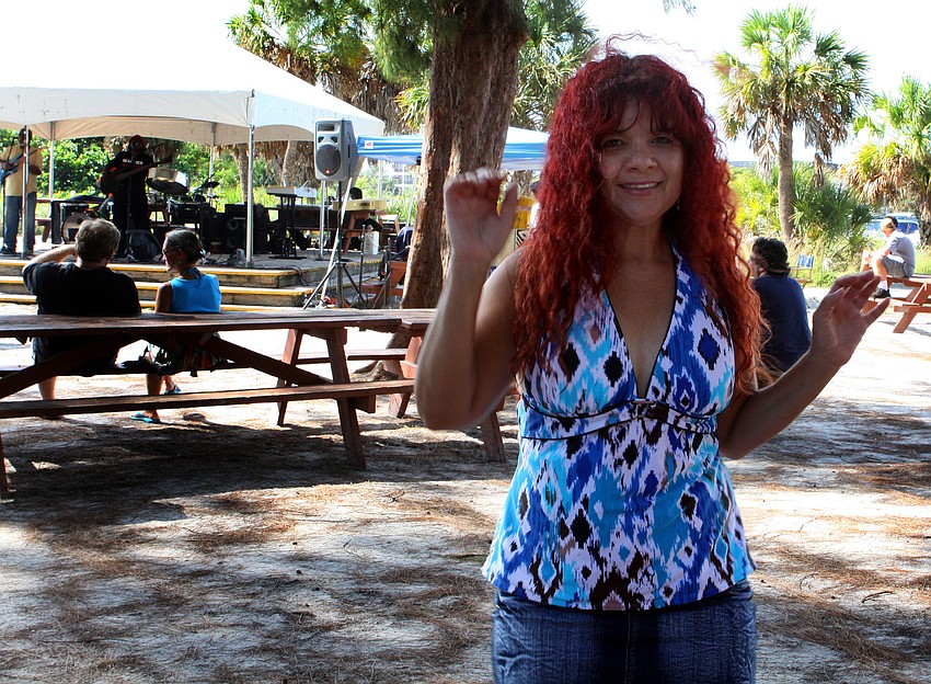 Alma Ramierez has fun dancing to the music of The Ciceron Brothers.