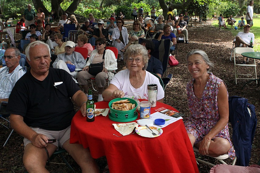 Mario Spalatin, Rose Sujdak and Jean Ranallo enjoy homemade cookies and beers from the beer garden Sunday, Oct. 9 during GartenFest at Marie Selby Botanical Gardens.
