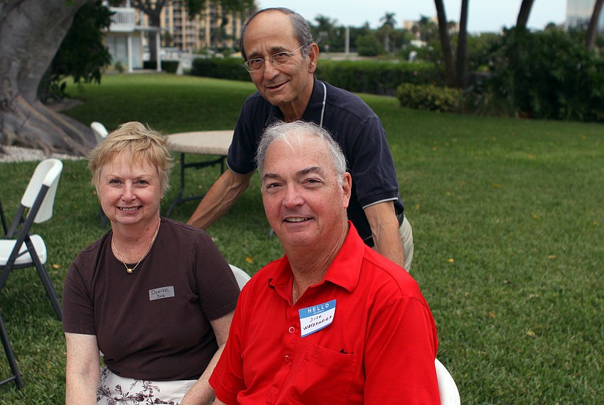 Wally Kraemer poses between Denise and Dick Watermeier