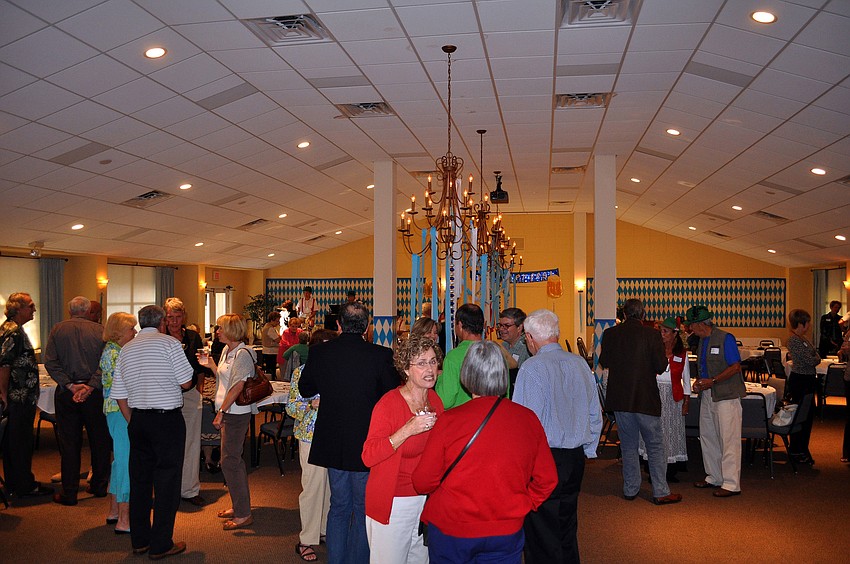 People mingled and enjoyed some wine and beer prior to dinner Friday, Oct. 21, at St. Boniface's.