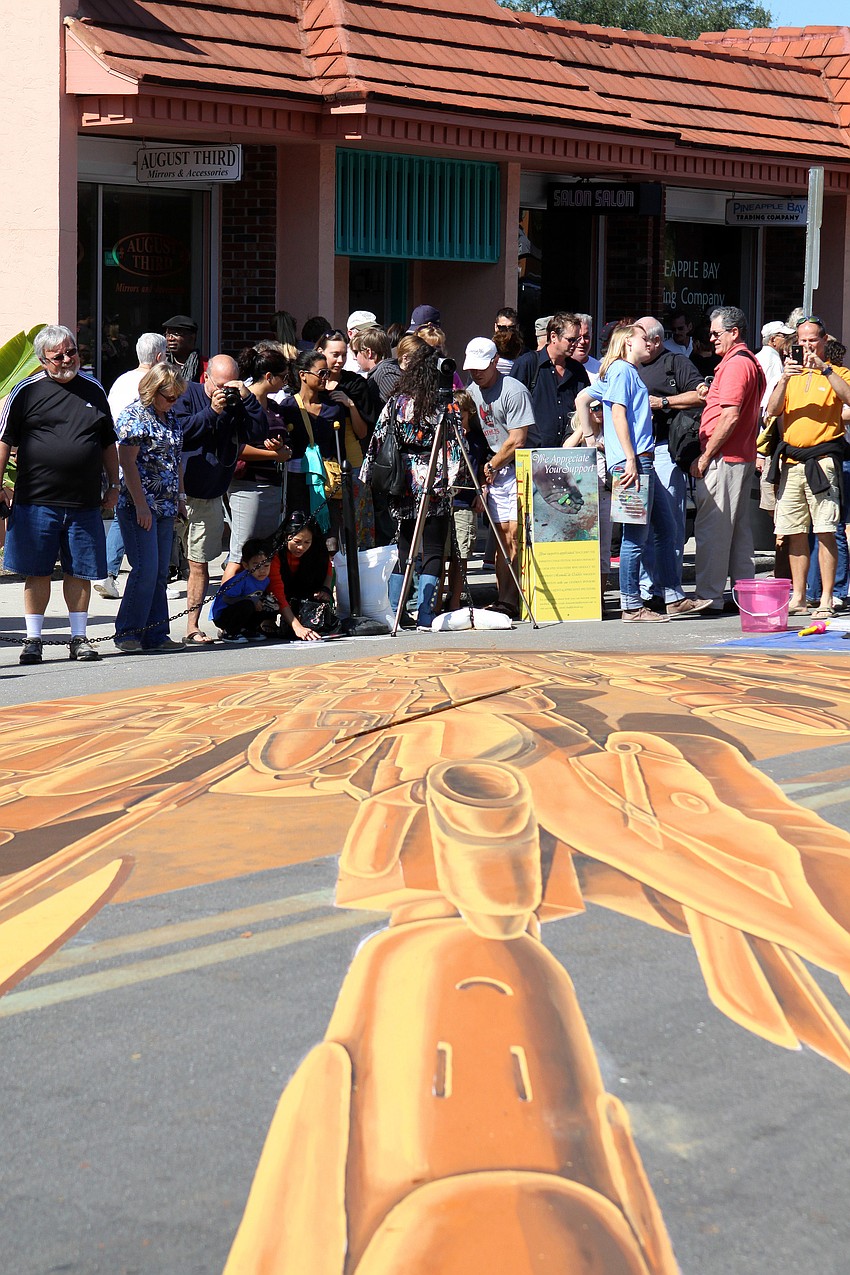 Hundreds of people donated money to be able to look through the glass lens and see the 3D effect of the Lego piece.