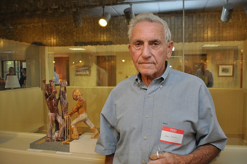 Sculptor Joel Seiden with his work â€œOccupy Wallstreetâ€