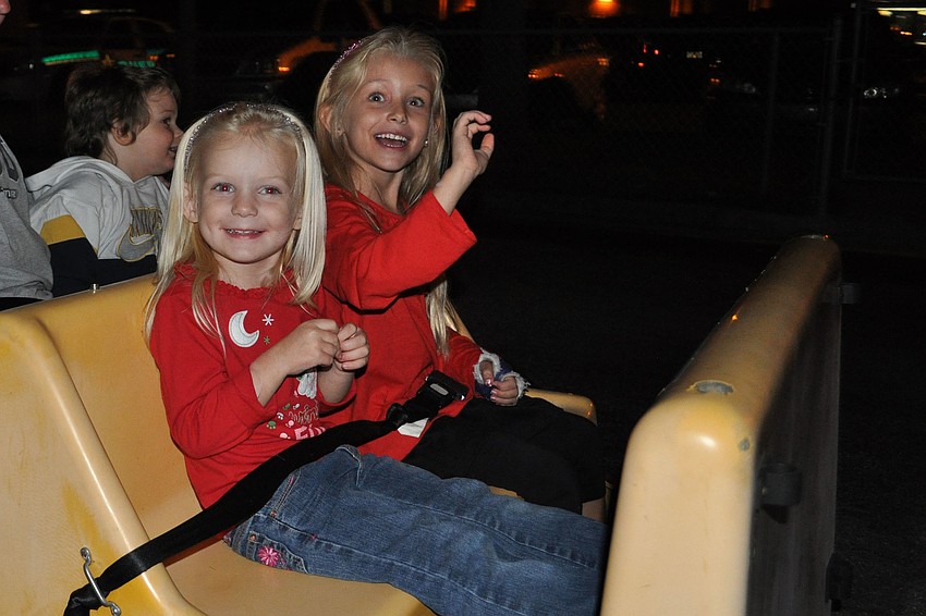 Chelsea and Madilyn Gemme waved to their parents as the train took off.