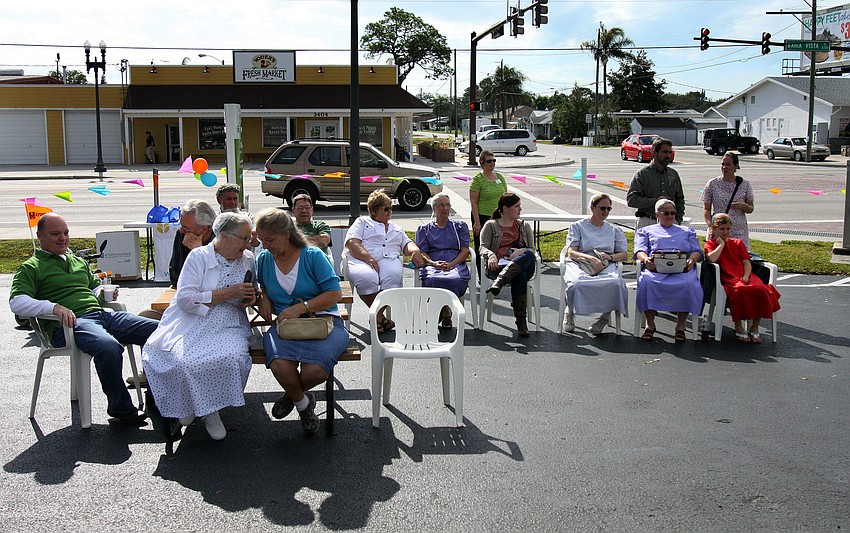 Pie-makers and spectators watched as the judges taste each of the 21 pies entered into the 1st annual pie contest, Friday, Dec. 9 at Everence Federal Credit Union.