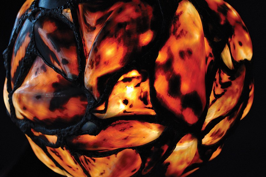 Diana and Scott Drake make lamps using rare, natural, exotic shells, such as this lamp, which was on display during the Sarasota Master Art Festival in February.