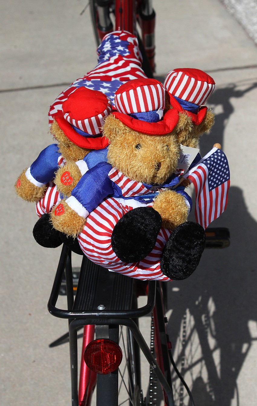 Peggy Shanahan decorated her bike with three, patriotic bears to symbolize the three men who raised the American Flag at the World Trade Center following the attacks in 2001