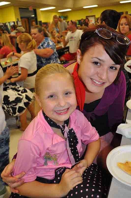 Demi Sherry, 6, enjoyed dinner with her sister, Lonna, and parents, Amanda and Rich, not pictured.