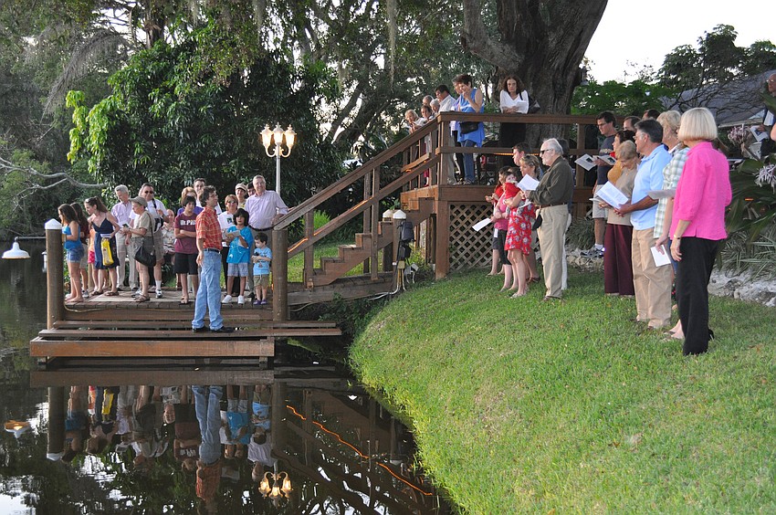 Members of Temple Emanu El gather together for a Tashlich service and prepare to cast their sins away by symbolically throwing bread into the water.