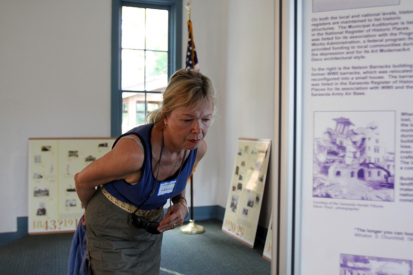 Angelika Wanless reads up on some of the history of Sarasota inside the Crocker Memorial Church.
