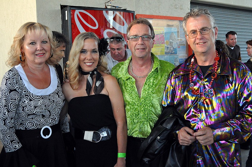 Lynn and Bob Shaffer pose between Sheila and Mike Lewis at Sandfest 2011, Friday, Nov. 4, at Siesta Key Beach Pavilion.