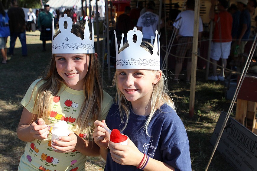 Rachel, 10, and Daphne, 8, Davis enjoy a sweet, ice-cold treat while wearing their very own crowns.