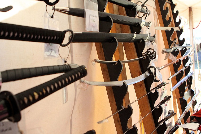 Many people enjoyed looking at swords that were for sale from some of the vendors at the fair.
