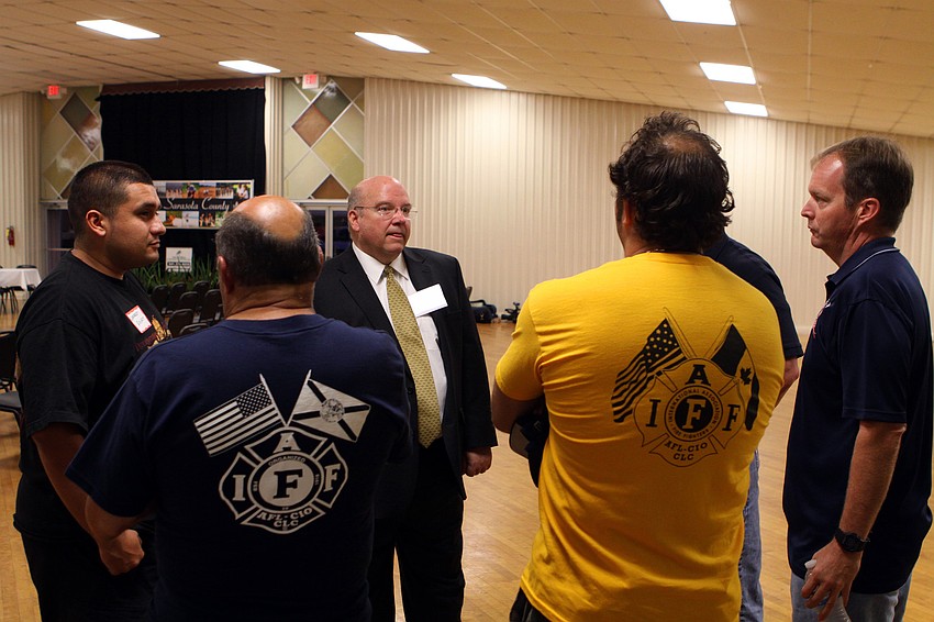Randall Reid chats with some local firemen who came out to the 