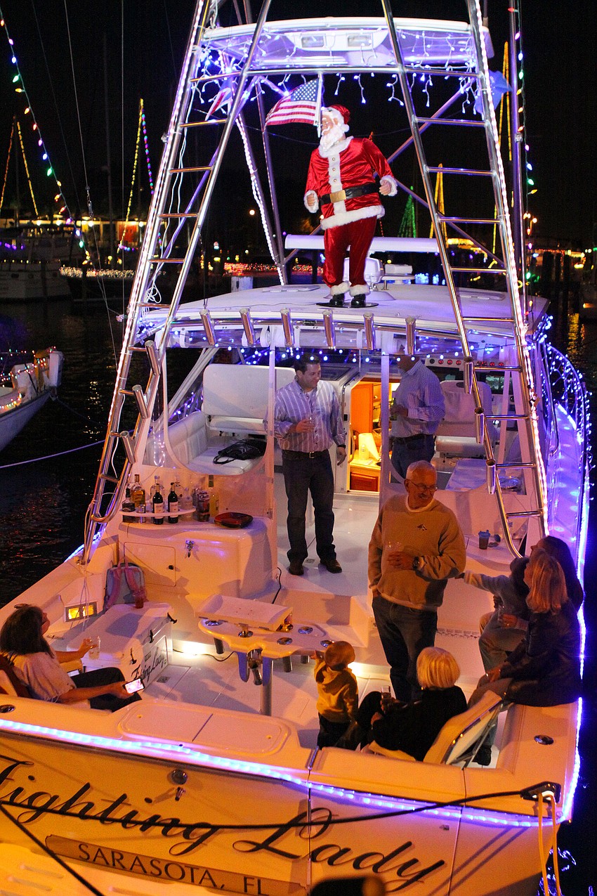 The Fighting Lady was decked out in lights and even had a dancing Santa.