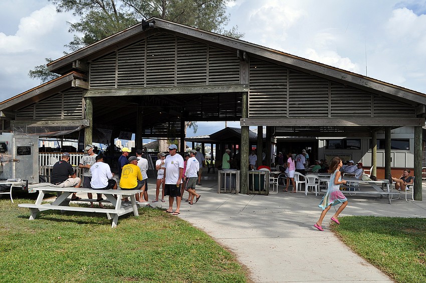 People enjoy some shade and food Saturday, Sept. 3 at the 65th Labor Day Regatta at the Sarasota Sailing Squadron.