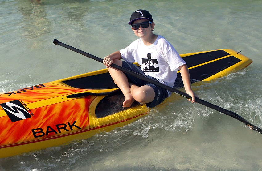 Connor Rosenberry, 8, enjoyed trying out paddleboarding Saturday, Sept. 17, during the Hang Ten for Autism surf event at the Siesta Key Public Beach.