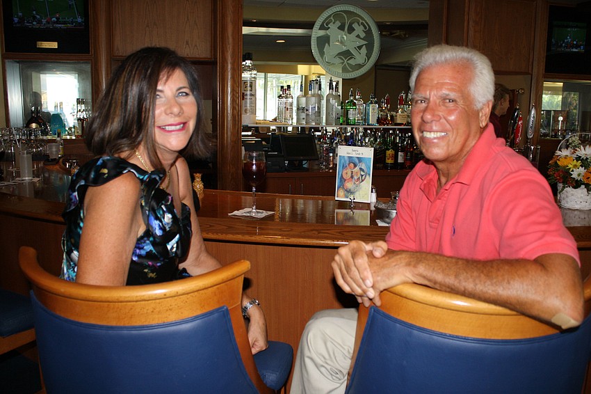 Rebecca Sachs and Commodore Bob Baime pose for a photo.
