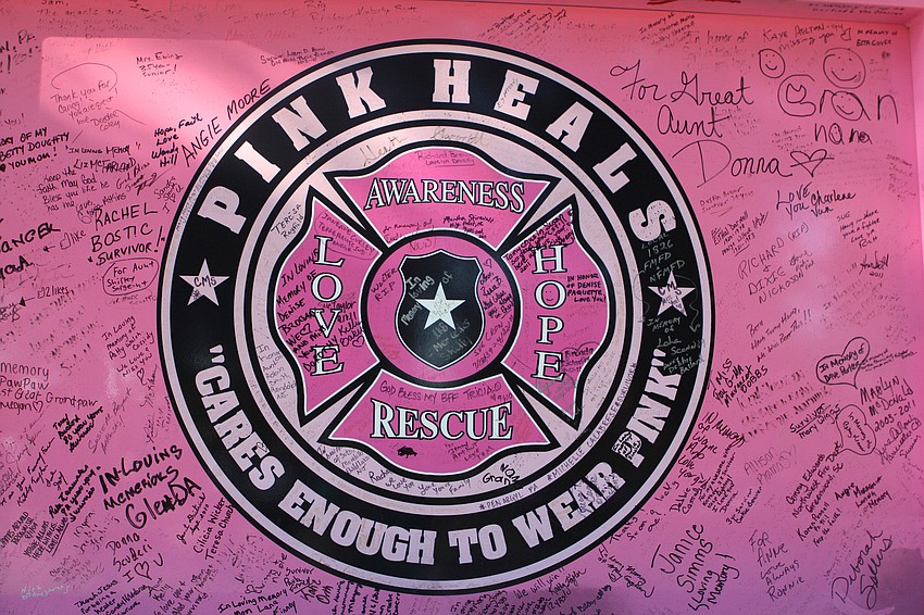 The Pink Heals logo is filled with messages written in Sharpie of love and hope.
