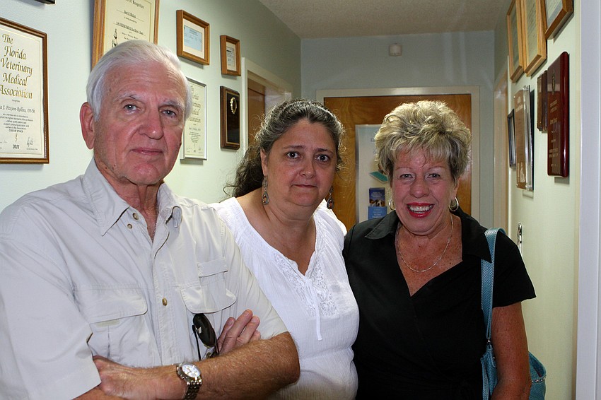 Harry and Alice Nelson pose with Dr. Lisa Paxson who helped organize the surprise party.