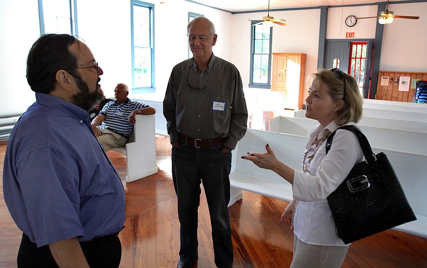Howard Rosenthal, one of the docents for the Crocker Memorial Church, talks with Leaf Wanless and Debbie Milor.