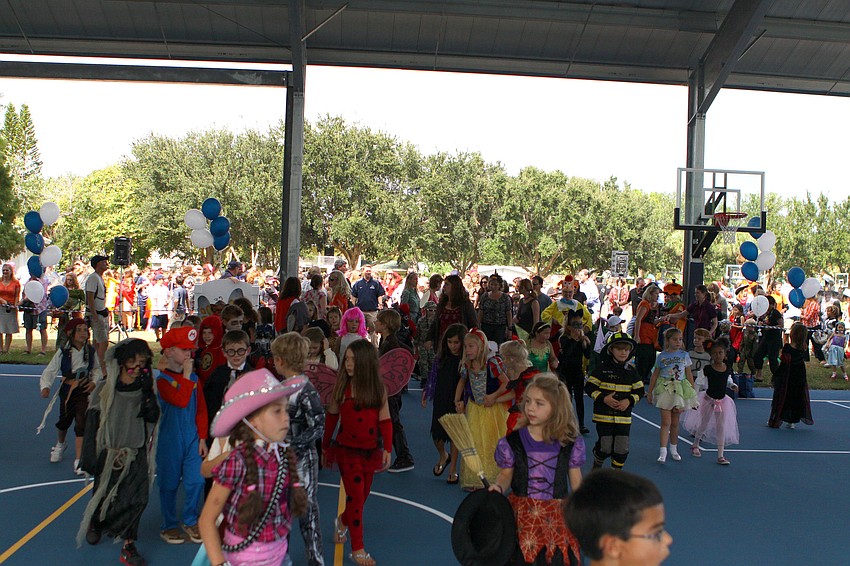 Students, faculty and parents made their way into the pavilion, Monday, Oct. 31, as part of the opening of the Lower School Athletic Pavilion donated by the Dart Family at Out-of-Door Academy.
