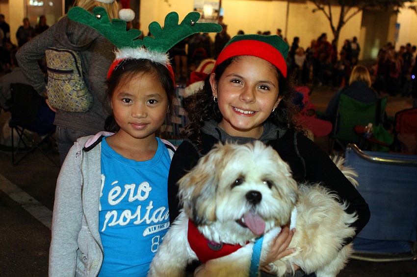 Kaylee Tran, 9, and Juliana Villa, 8, with her dog, Toby.