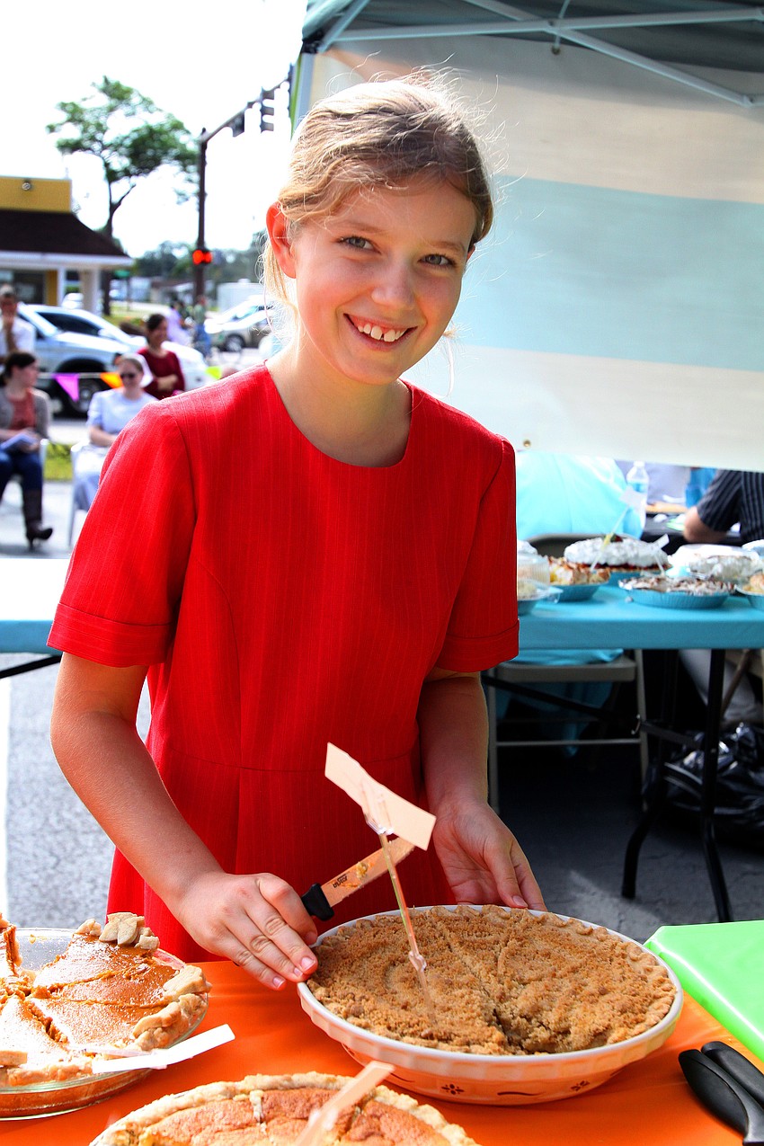 Elizabeth Yoder cuts up the pies and gets them ready for people to try during the 1st annual pie contest, Friday, Dec. 9 at Everence Federal Credit Union.
