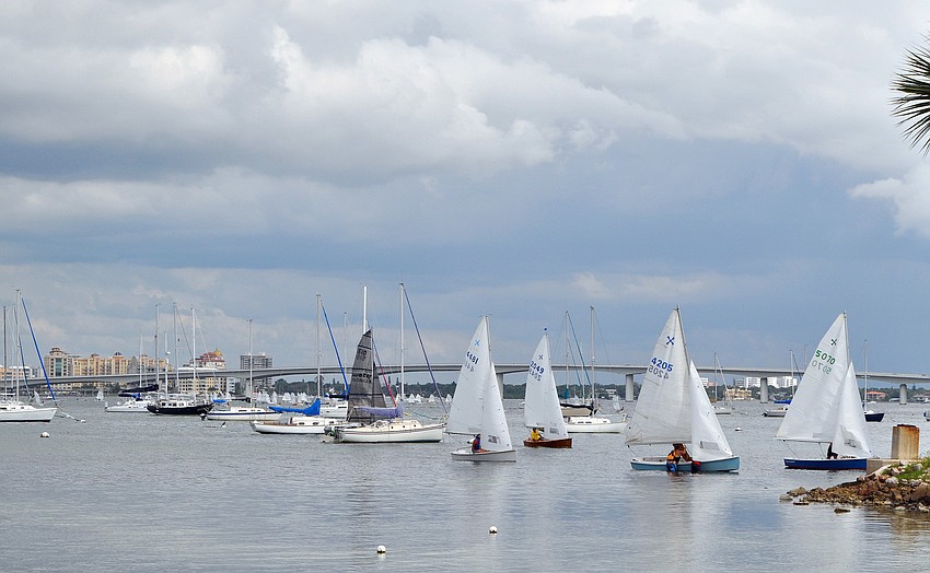 Sailboats come in from racing with the Ringling Bridge in the background Saturday, Sept. 3 at the 65th Labor Day Regatta at the Sarasota Sailing Squadron.