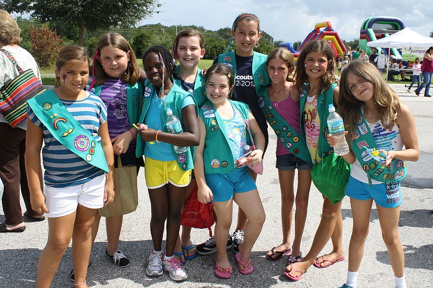 Brinna Parker, Emily Erickson, Deanndra Swearing, Tabitha Wittek, Abigail Adams, Krystel Klaput, Hailey Kinlaw, Hallie Hart and Stephanie Clarke pause their game playing for a photo. These girls are part of troop 676 in Northport.
