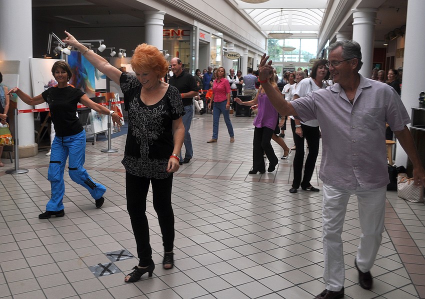 Toby Kelley, of Sara Dance Studio, led her line dancing students in a line dance during the D2L Dance Party â€œBehind The Ropesâ€ Sunday, Sept. 25, at Westfield Southgate.