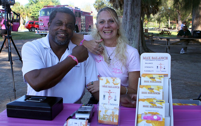 Terry Rhodes and Deonnah Delliveau pose with their pink Max Balance bands.
