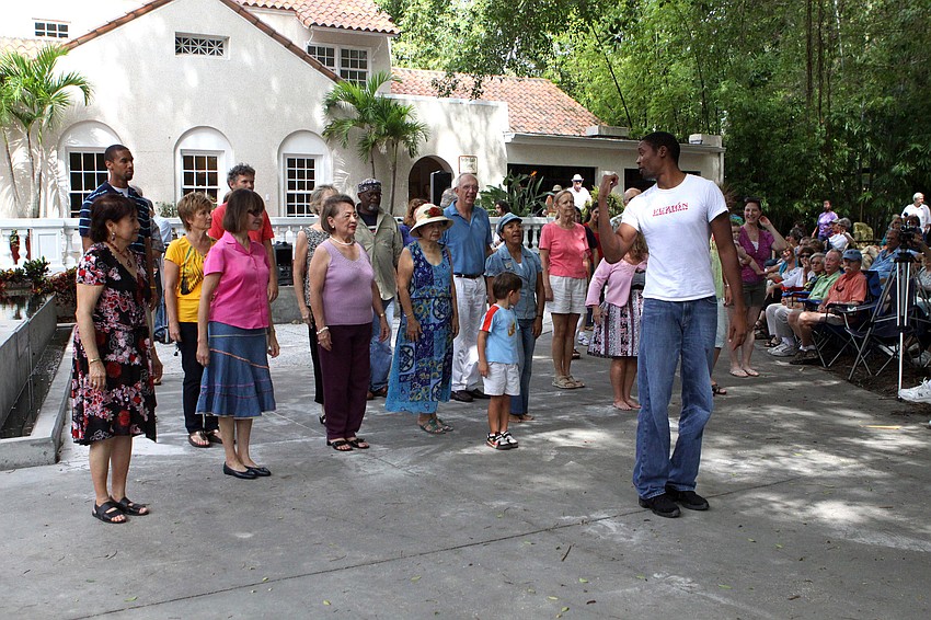 Volunteers from the crowd try and follow the instructions in order to learn a few basic Mambo moves.