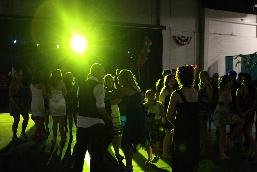 Students dance together on the dance floor Saturday, Oct. 15 during the Sarasota High School homecoming dance at Robarts Arena.