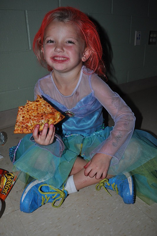 Ella East, 5, ate pizza with her twin sister, Addison, not pictured.