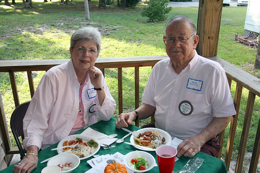 Diane and Pete Esthus enjoy their dinner on the back porch of the Bidwell-Wood House.