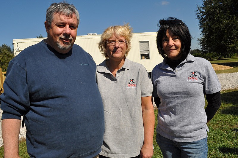 Mark Thomas, Cam McCarthy and Cathy Carrubba are volunteers with Honor.
