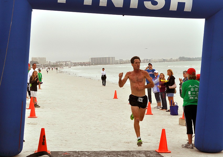 Mickey Hook of Bradenton was the first person and male to cross the finish line.