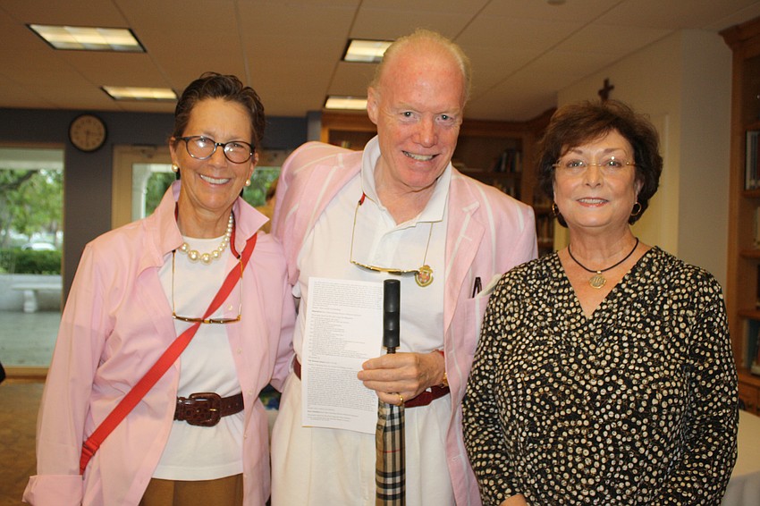 Kathy and Cooper Yaw are pretty in pink and enjoying conversation with Linda Robinson, the ministerâ€™s wife.