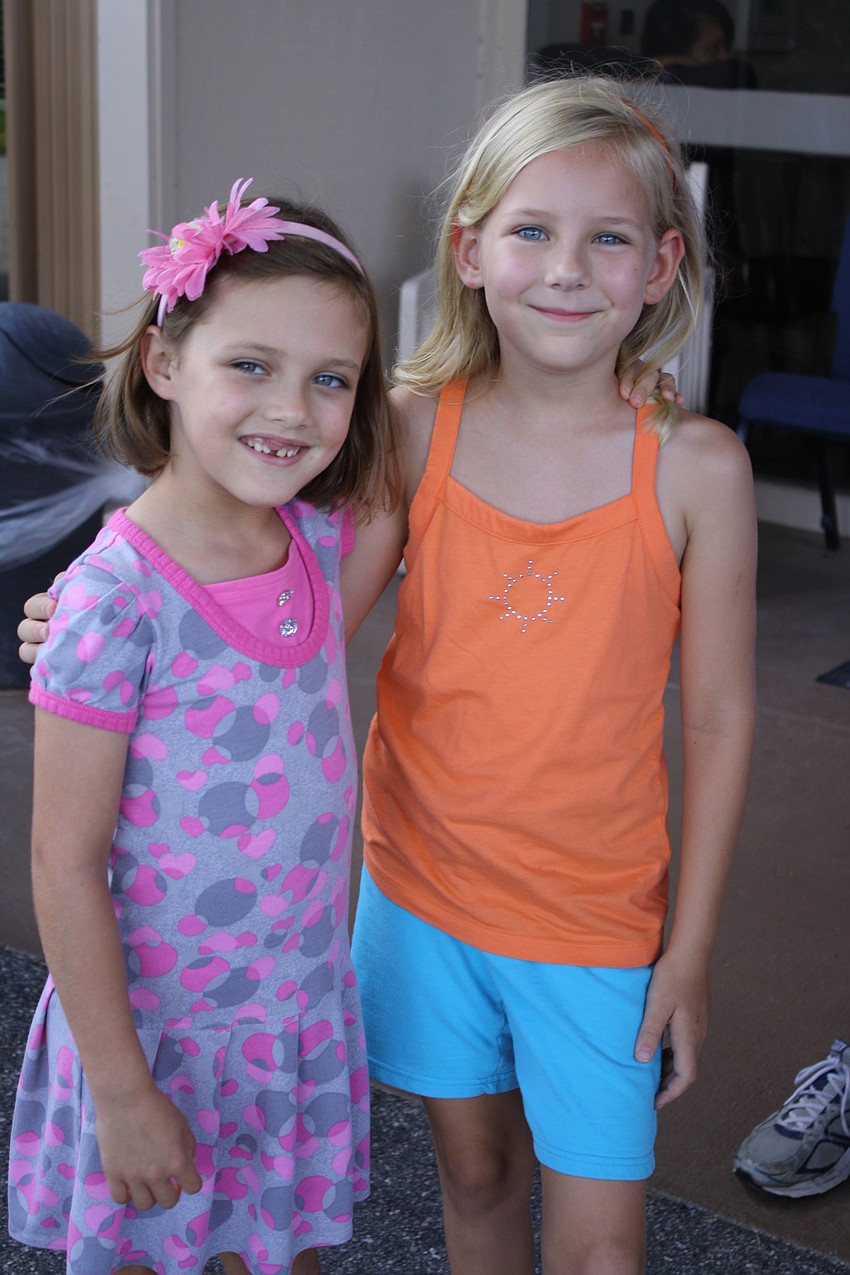 Six-year-old Lauren Vannostrand and 7-year-old Sarah Catalano are on their second year of being a Girl Scouts. They both like Thin Mint cookies.