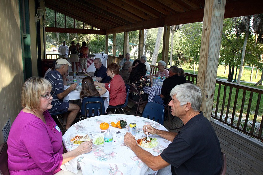 People enjoy eating their Broadway Bar dinner on the back porch of the Bidwell-Wood House.