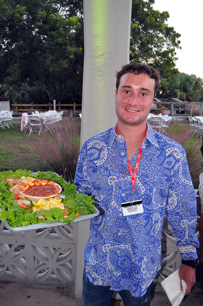 Tyler Thompson serving up shrimp.