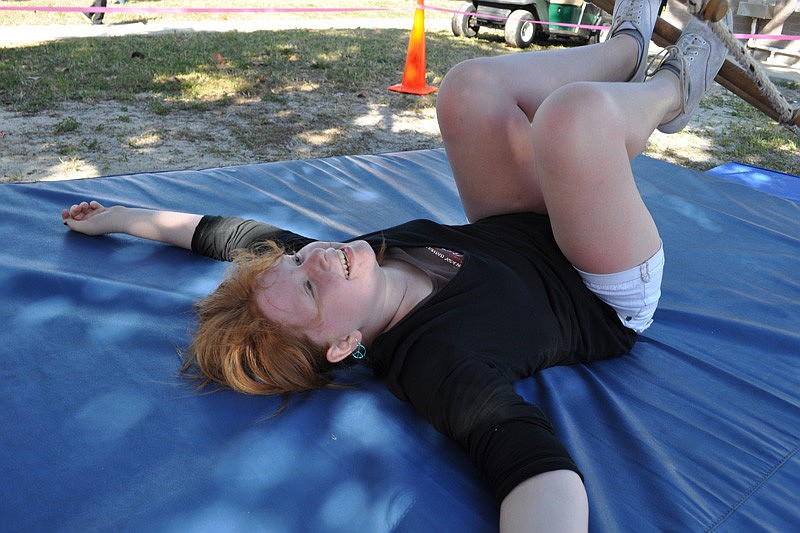 Megan Gold, 11, had fun purposefully falling off the rope ladder.
