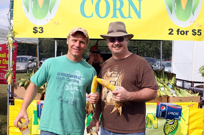 Dan Shulman and Matthew Anderson get some roasted corn.