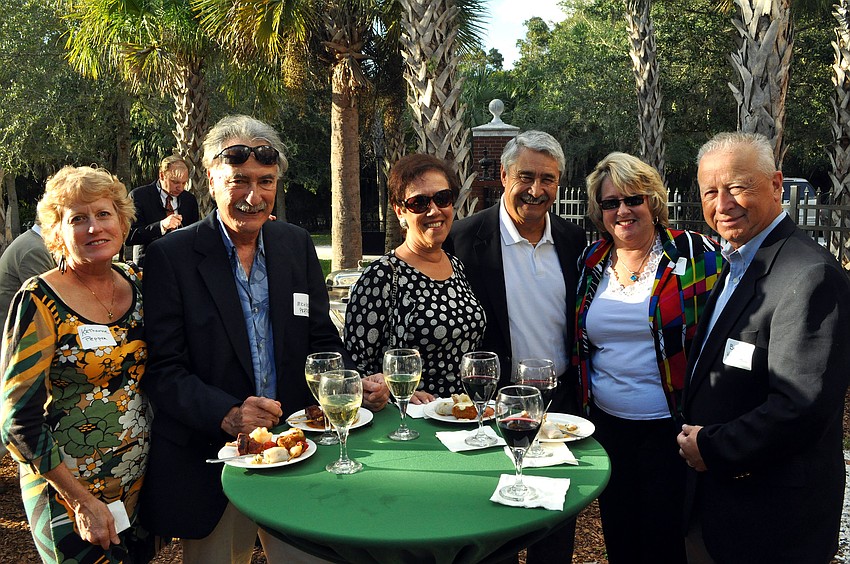 Katharine and Michael Pepper, Carol MacPhee, Jose and Joan Uranga and Bob MacPhee enjoy some food and wine provided by Michaelâ€™s on East.