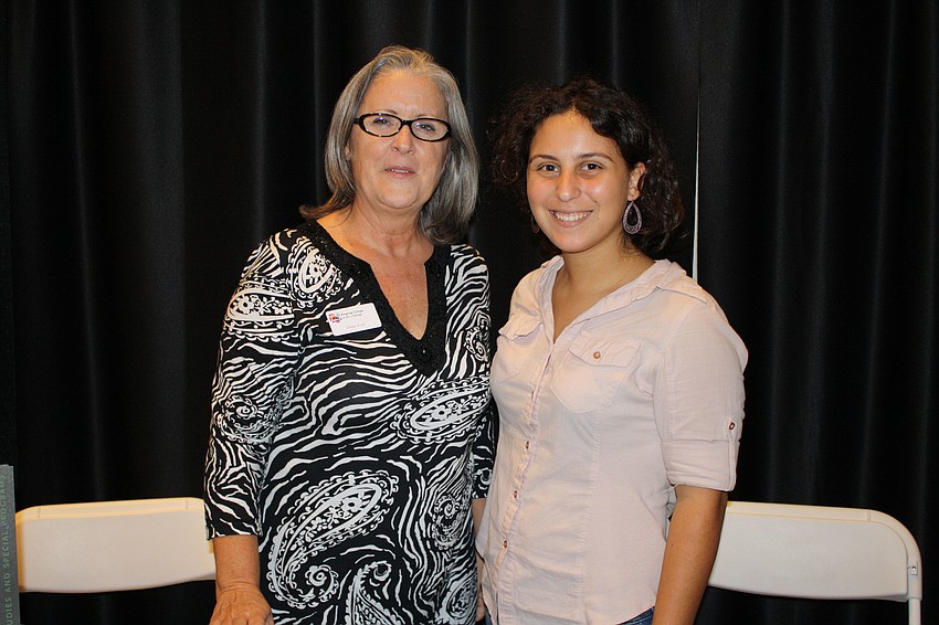 Diane Zorn and Senior Fellows Student Samantha Delia pose in front of the Ringling College of Art and Design booth.