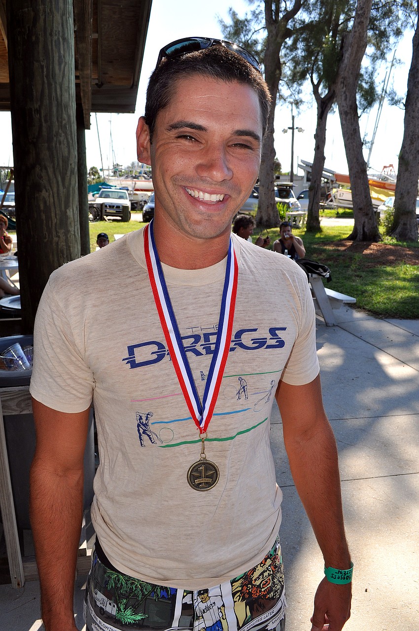 Jay Boggess of West Palm Beach wears his first place medal proudly.