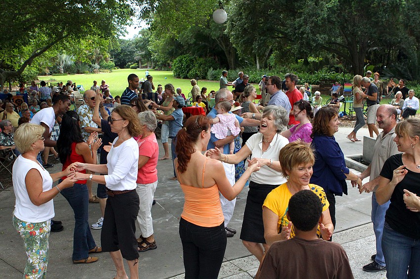 People from the crowd were encouraged to get up and try doing a few mambo steps with the help of the dancers from Fuzion Dance Sunday, Oct. 9 during GartenFest at Marie Selby Botanical Gardens.