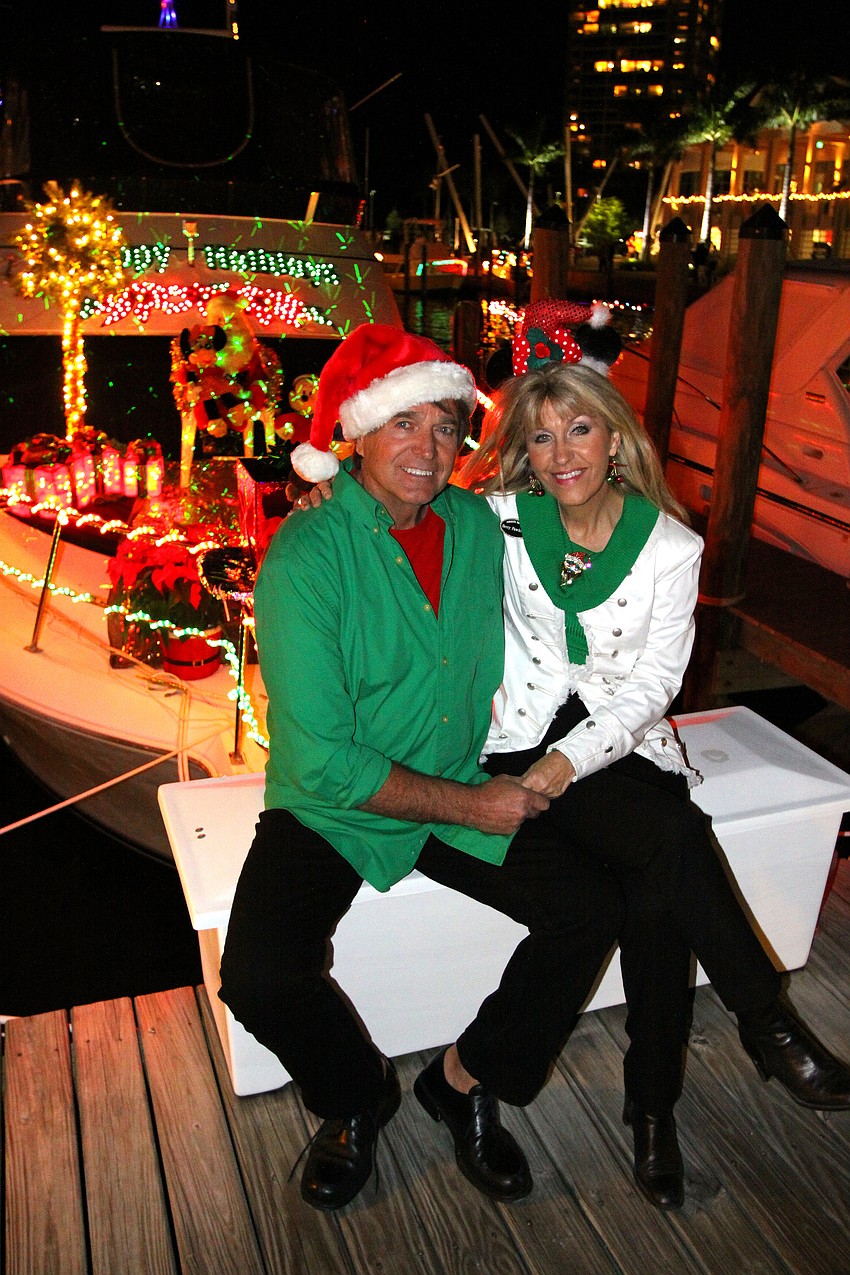 Harry and Betty Pawlowitz pose in front of their boat.