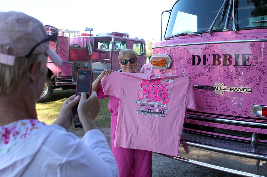Ursula Sellitti takes a photo of Maralee Morrissey with her new shirt in front of 